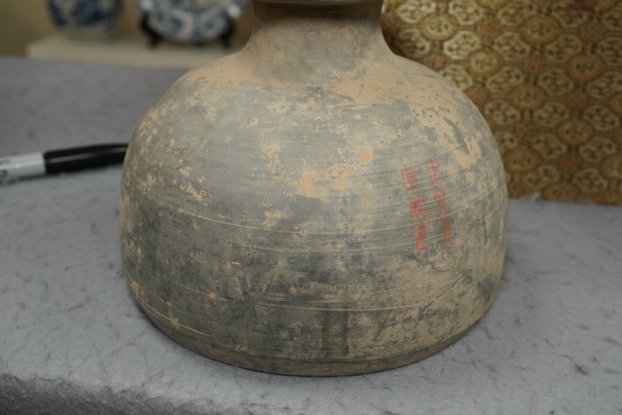 Four very rare Chinese inscribed pottery jars, Han dynasty